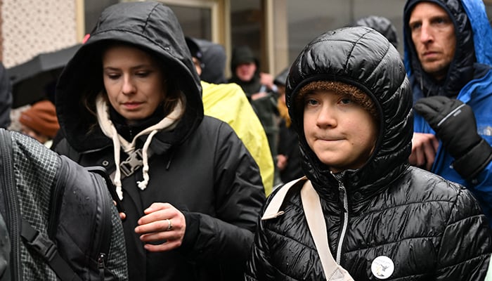 Swedish Climate activist Greta Thunberg (right) and German Climate activist Luisa Neubauer (left) take part in a large-scale protest to stop the demolition of the village Luetzerath to make way for an open-air coal mine extension on January 14, 2023. — AFP