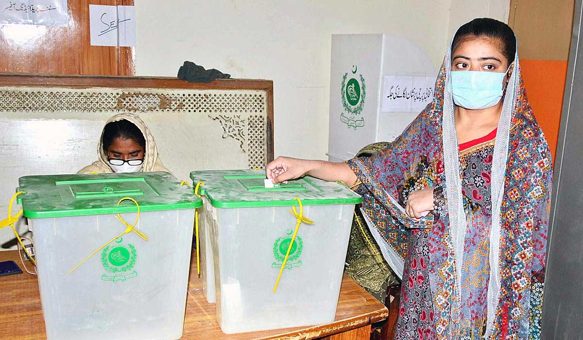 A young woman casts her vote during the second phase of the local body polls in Hyderabad. — APP