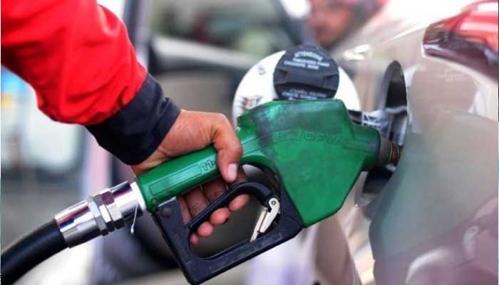 A photograph of a car being filled with petrol at a petrol station. — AFP/File