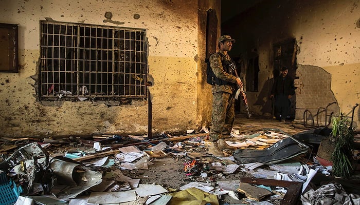 A soldier standing in a classroom after the APS attack in Peshawar.— Reuters