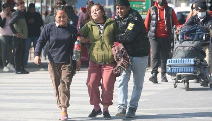 A family member of a victim of the aircraft that crashed in Pokhara is escorted as she mourns at the airport in Kathmandu, Nepal January 15, 2023. — Reuters