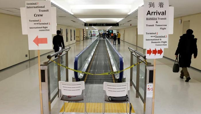 A passenger of a plane from Dalian in China, heads to the coronavirus disease (COVID-19) test area, upon his arrival at Narita international airport in Narita, east of Tokyo, Japan January 12, 2023. — Reuters