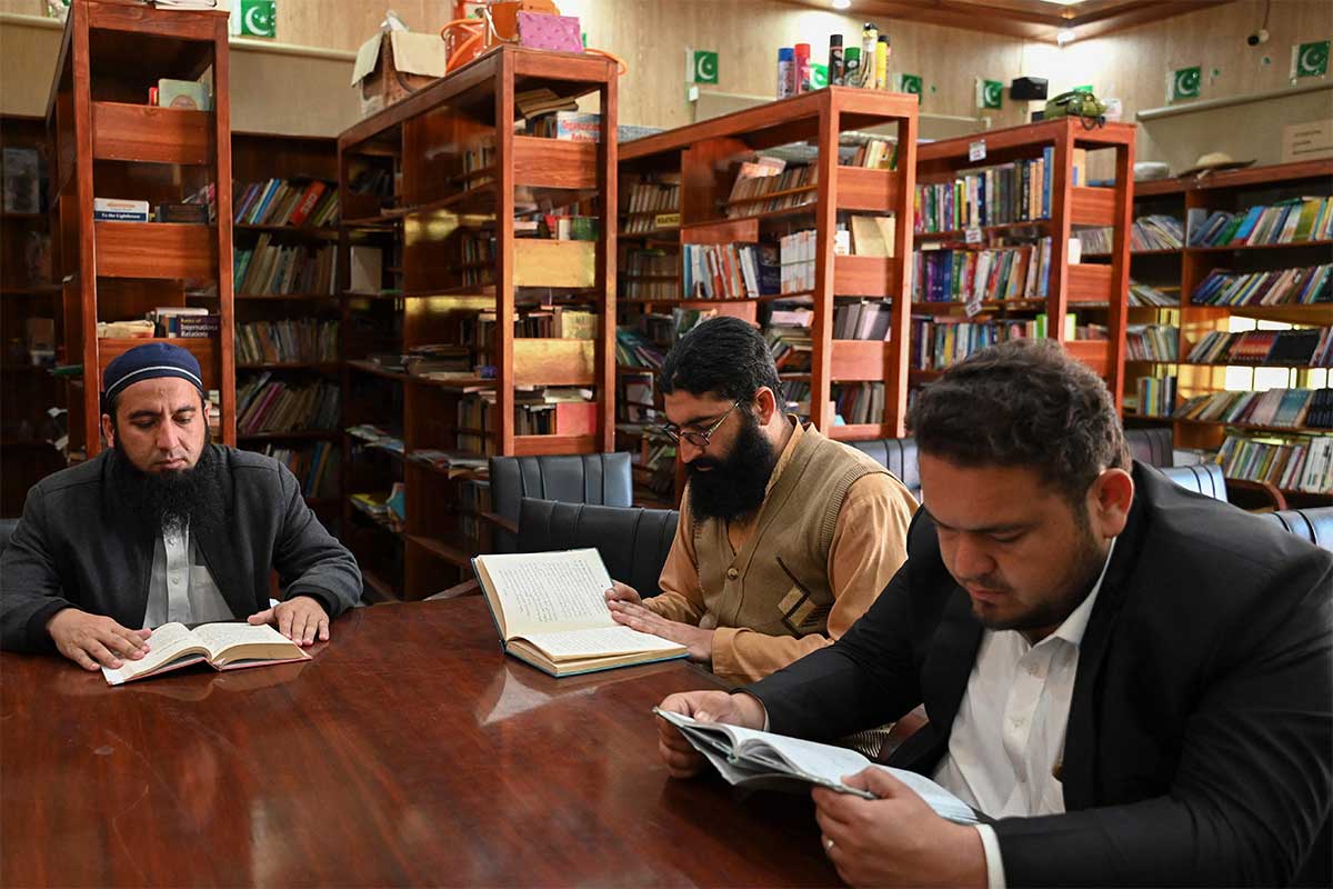 People read books inside the Darra Adam Khel Library. — AFP