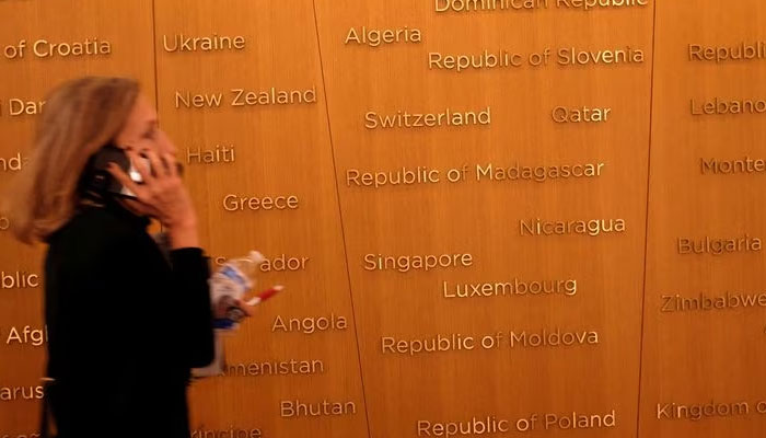 An attendee navigates the headquarters of the International Monetary Fund during the groups Annual Meetings in Washington, US, October 13, 2022. — Reuters