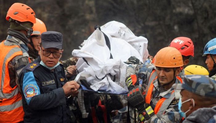 A rescue team recovers the body of a victim from the site of the plane crash of a Yeti Airlines operated aircraft on January 15, 2023, in Pokhara, Nepal January 16, 2023.— Reuters