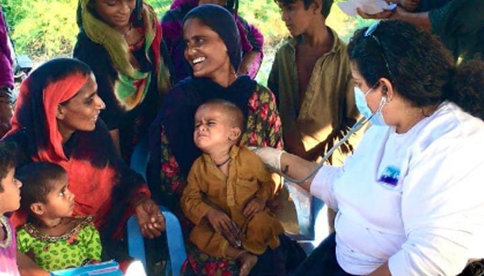 Dr. Geet Chainani examining patients at a Life Bridge medical camp in Keti Bander, Thatta, Sindh, October 2022. — Jaffar Hussain Khan