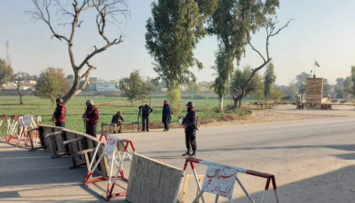 Security forces stand guard in Bannu on December 20, 2022. — Reuters