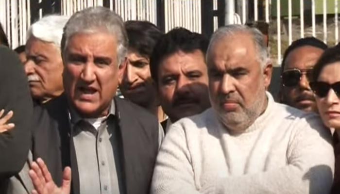 Pakistan Tehreek-e-Insaf (PTI) leaders Shah Mahmood Qureshi (L) and Asad Qaiser speaking during a press conference outside Parliament House on January 20, 2023. — YouTube screengrab/Geo News Live