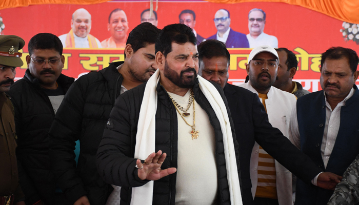 Wrestling Federation of India (WFI) president Brij Bhushan Sharan Singh (C) arrives to address a press conference in Gonda on January 20, 2023.—  AFP