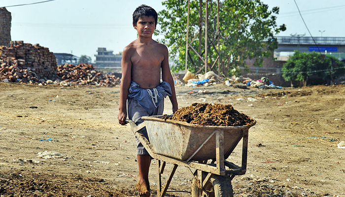A young boy can be seen working in Lahore on June 11, 2022. — Online