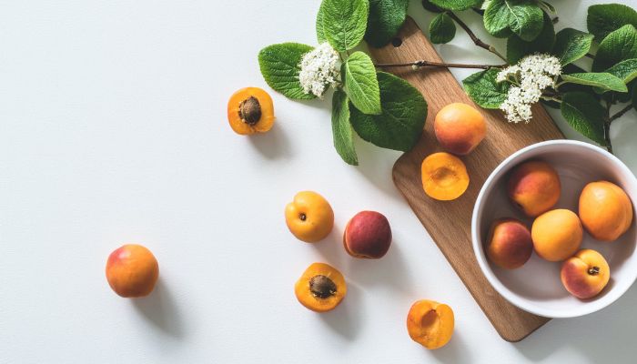 Image shows apricot fruits in a bowl.— Pexels