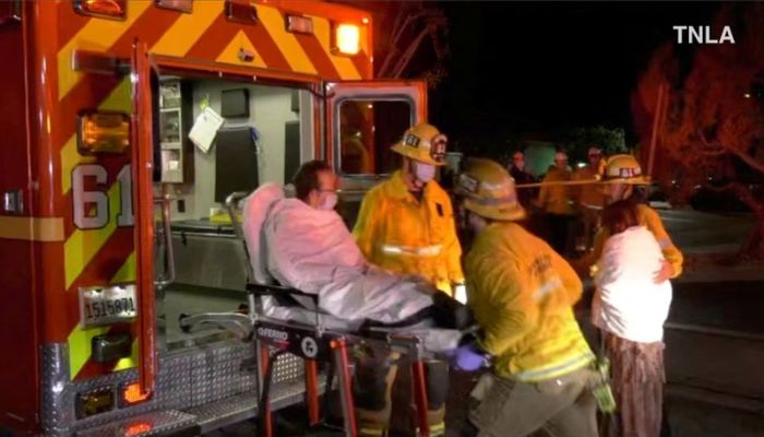 A screenshot from a video shows emergency responders assisting a person to an ambulance following a shooting at Monterey Park, California, US January 22, 2023.— Reuters