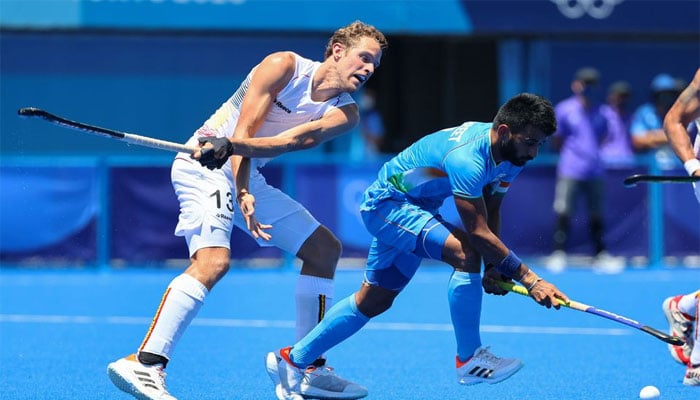 Manpreet Singh of the Indian hockey team in action against Nicolas De Kerpel of Belgium. — Reuters/File