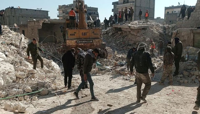 Members of a rescue team work on the scene of a residential building collapse in the Sheikh Maksoud neighbourhood of Aleppo, Syria, January 22, 2023. — Reuters