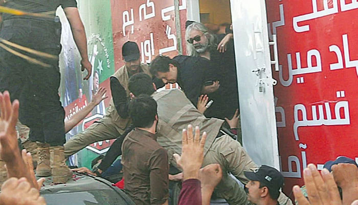 PTI Chairman Imran Khan is being shifted to hospital from the container after the attack. — Twitter/File