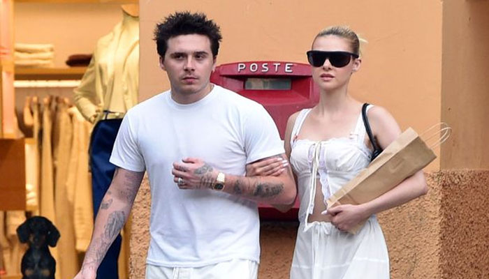 Brooklyn Beckham spotted sporting dad David Beckhams old England football shirt on day out with Nicola Peltz