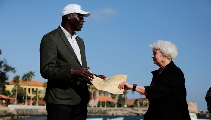 US Treasury Secretary Janet Yellen receives a pilgrim award certificate from Augustin Senghor, Mayor of the Goree Island, after she visited the House of Slaves (Maison des Esclaves) at Goree Island off the coast of Dakar, Senegal January 21, 2023.— Reuters