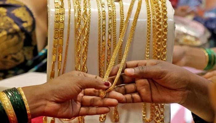 A representational image of customers looking at gold chains. — Reuters/File