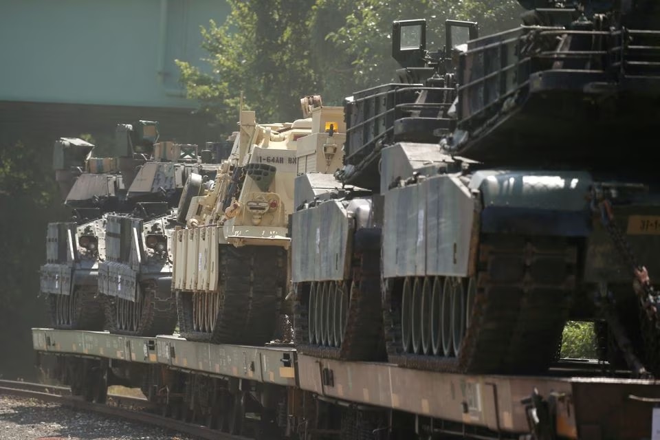 M1 Abrams tanks and other armored vehicles sit atop flat cars in a rail yard after U.S. President Donald Trump said tanks and other military hardware would be part of Fourth of July displays of military prowess in Washington, U.S., July 2, 2019. — Reuters