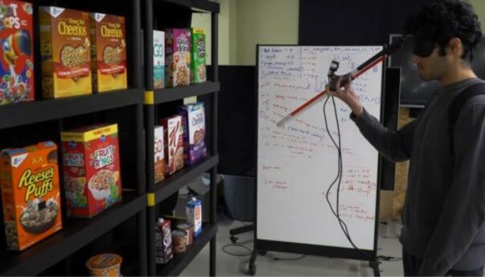 Subject tests a smart walking stick for people who are blind or visually impaired in a mock grocery store.— Colorado.edu