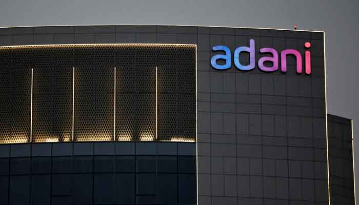 The logo of the Adani Group is seen on the facade of one of its buildings on the outskirts of Ahmedabad, India, April 13, 2021. —Reuters