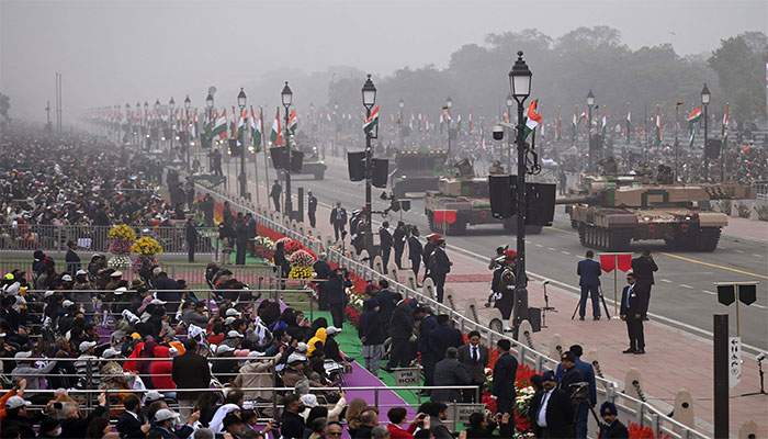 Spectators watch the parade in New Delhi. — AFP