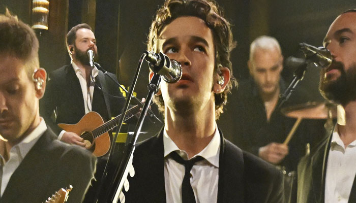 The 1975 frontman Matty Healy interrupted by bandmates before making a racial comment in concert