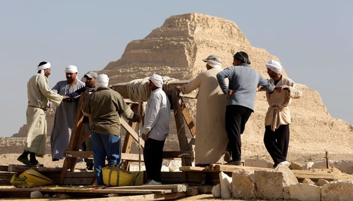 People work at the site after the announcement of the discovery of 4,300-year-old sealed tombs in Egypts Saqqara necropolis, in Giza, Egypt, January 26, 2023.— Reuters