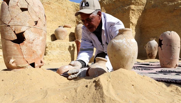 An Egyptian archaeologist restores antiquities after the announcement of the discovery of 4,300-year-old sealed tombs in Egypts Saqqara necropolis, in Giza, Egypt, January 26, 2023.— Reuters