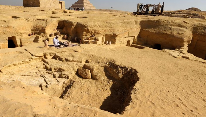 An Egyptian archaeologist restores antiquities after the announcement of new discoveries in Gisr el-Mudir in Saqqara, in Giza, Egypt, January 26, 2023.— Reuters