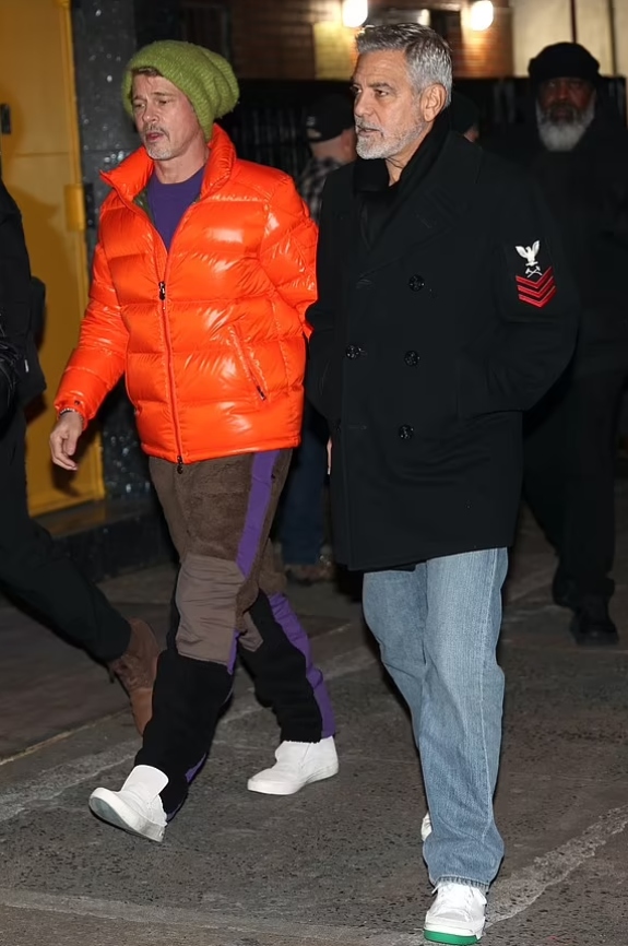 Brad Pitt sports bright orange puffer coat with George Clooney on set of ‘Wolves’