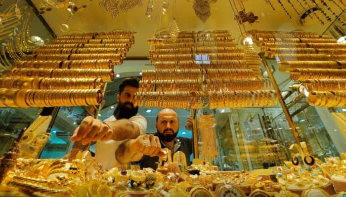 Goldsmiths arrange products in a gold and jewellery store in Istanbul, Turkey, June 14, 2018. — Reuters