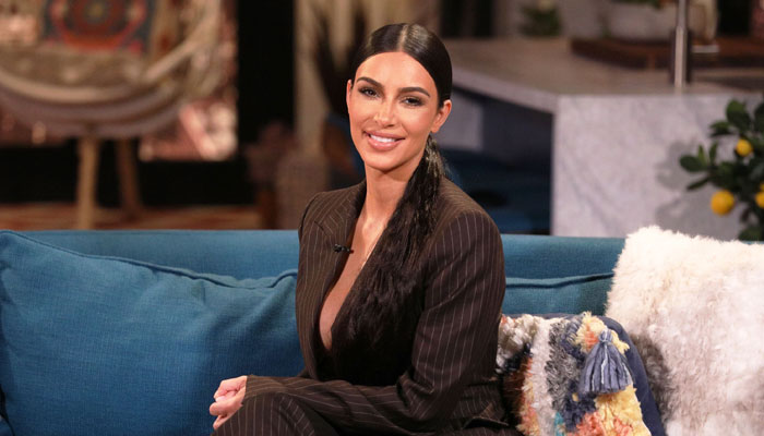 Kim Kardashian poses with former prisoners as she continues prison reform work