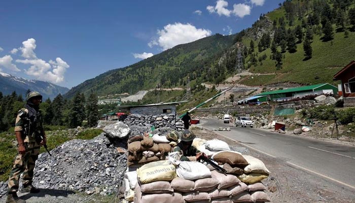 Indian soldiers guard a checkpoint along a highway leading to Ladakh, at Gagangeer in occupied Kashmirs Ganderbal district on June 17, 2020. — Reuters