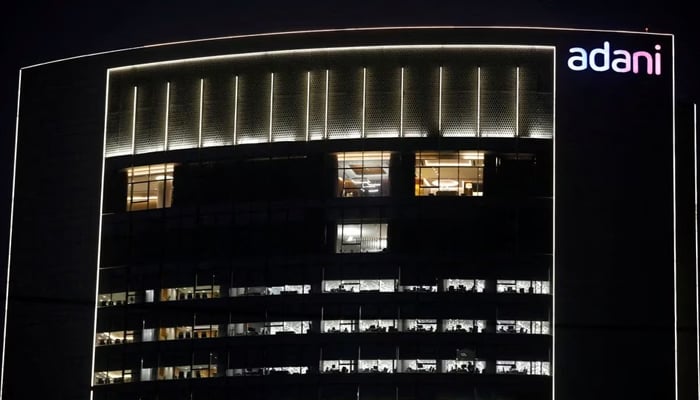 The logo of the Adani Group is seen on the facade of its Corporate House on the outskirts of Ahmedabad, India, January 27, 2023. — Reuters