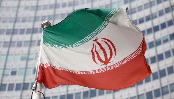 The Iranian flag waves in front of the International Atomic Energy Agency (IAEA) headquarters in Vienna, Austria, March 1, 2021. REUTERS/File