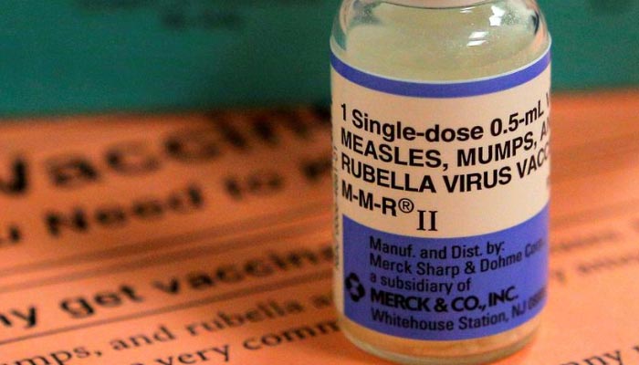 A vial of vaccine for measles, mumps, and rubella is seen alongside an information sheet at Boston Childrens Hospital in Boston, Massachusetts, US, February 26, 2015. REUTERS/File