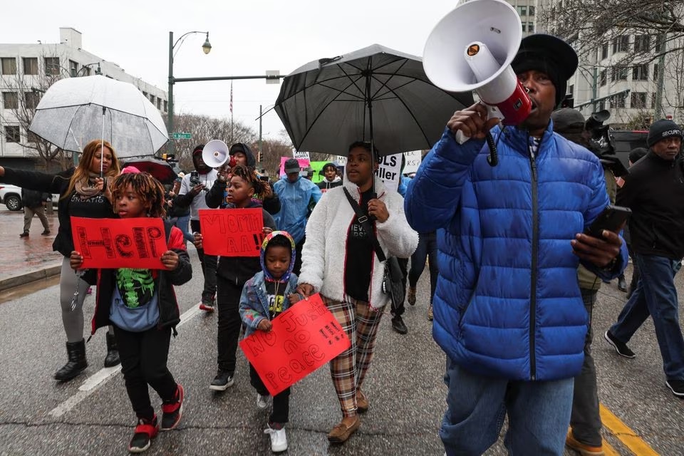Nakia, Daniel 5, Darius 11 and Devonte 8 take part in a protest after the release of the body cam footage showing police officers beating Tyre Nichols, who then died three days later after he was pulled over while driving during a traffic stop by Memphis police officers, in downtown Memphis, Tennessee, U.S., January 28, 2023.— Reuters