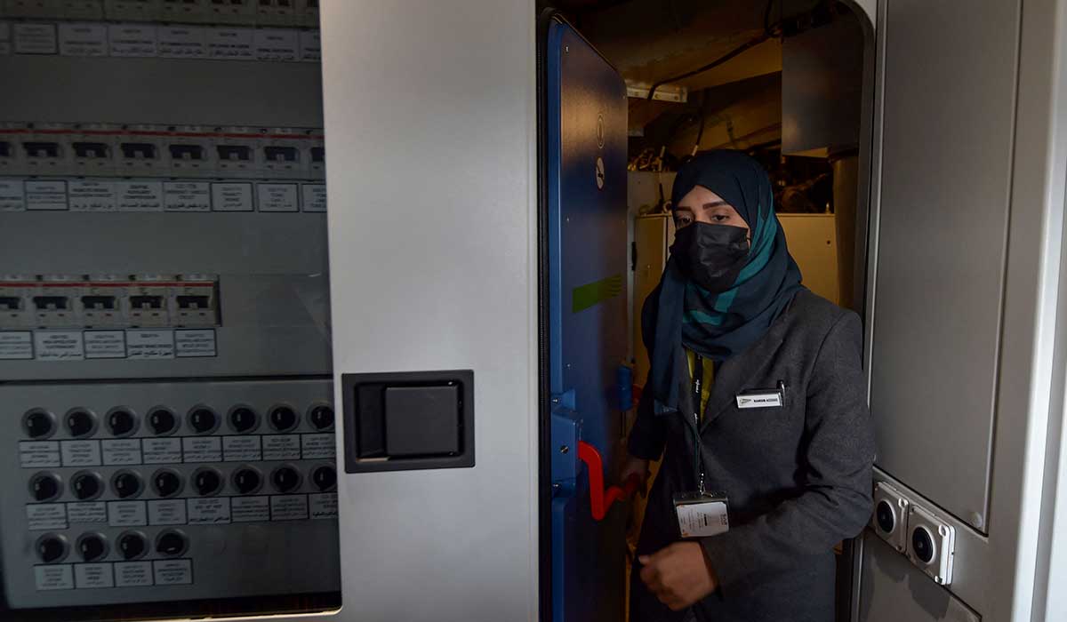 Raneem Azzouz enters the drivers cabin of the high-speed train. — AFP