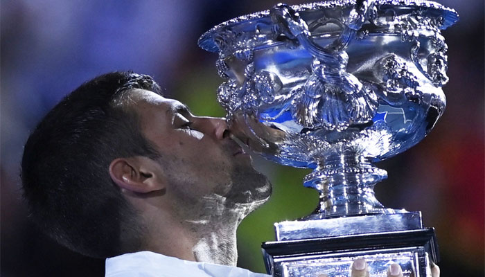 Serbias Novak Djokovic celebrates with the trophy after winning his final match against Greeces Stefanos Tennis in Australian Open Mens Singles Final on January 29, 2023. — Reuters
