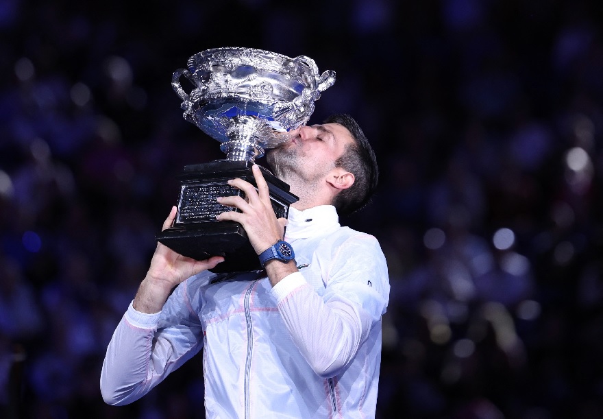 Novak Djokovic celebrates with the trophy after winning his final match. — Reuters