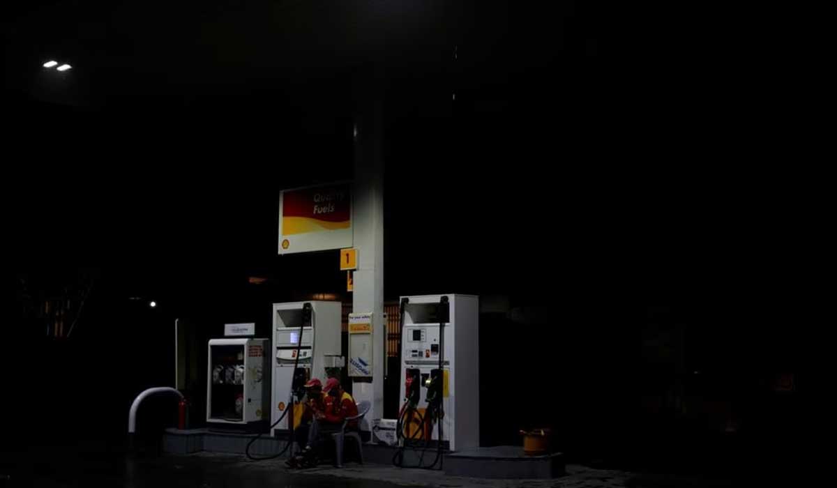 Employees sit next to fuel pumps as they close the petrol station after running out of petrol, in Islamabad, July 26, 2017. — Reuters