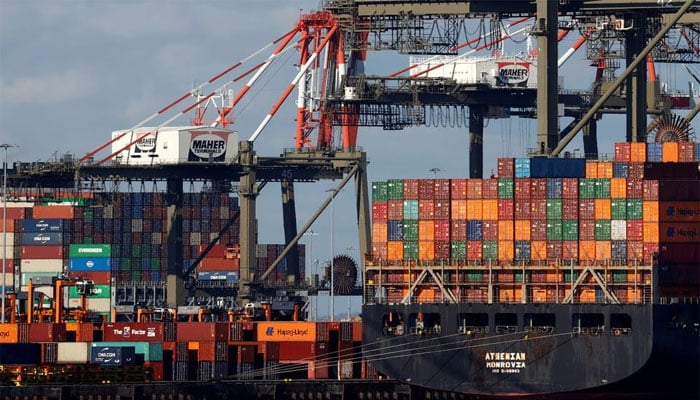 A ship stacked with shipping containers is unloaded on a pier at Port Newark, New Jersey, US. — Reuters/File