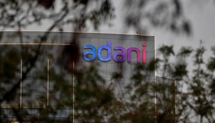 The logo of the Adani Group is seen on the facade of its Corporate House on the outskirts of Ahmedabad, India, January 27, 2023.