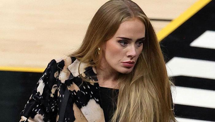 Adele reveals her father once placed trash bag over her head