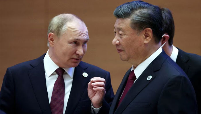 Russian President Vladimir Putin speaks with Chinese President Xi Jinping before an extended-format meeting of heads of the SCO member states in Samarkand, Uzbekistan on September 16, 2022. — Reuters.
