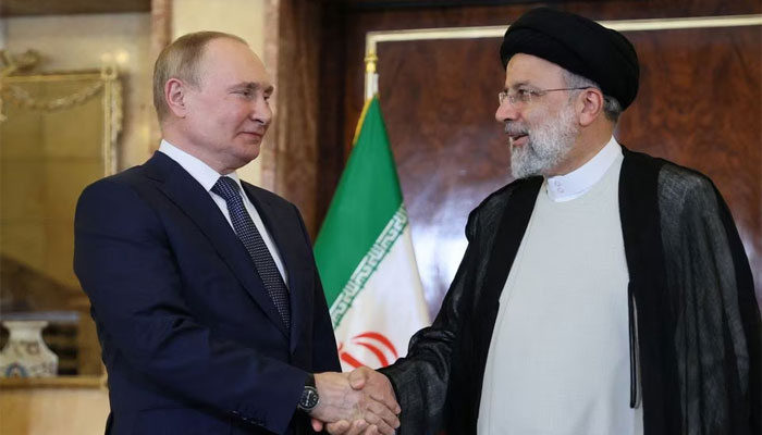 Russian President Vladimir Putin (left) shakes hands with Iranian President Ebrahim Raisi during a meeting in Tehran, Iran July 19, 2022. — Reuters