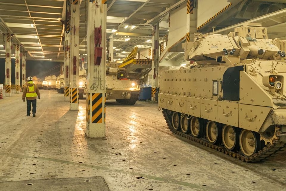 A convoy of Ukraine-bound Bradley Fighting Vehicles load onto the carrier ARC Integrity at the Transportation Core Dock in North Charleston, South Carolina, U.S. January 25, 2023.