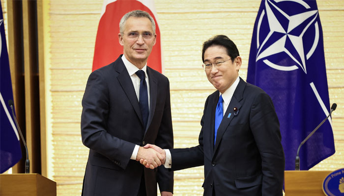 NATO Secretary-General Jens Stoltenberg (L) and Japans Prime Minister Fumio Kishida shake hands after holding a joint media briefing in Tokyo on January 31, 2023. — AFP