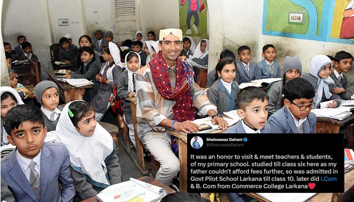 Pakistan pacer Shahnawaz Dahani poses while seated in a classroom with students during a visit to his primary school in Larkana on January 31, 2023. — Instagram/ShahnawazDahani